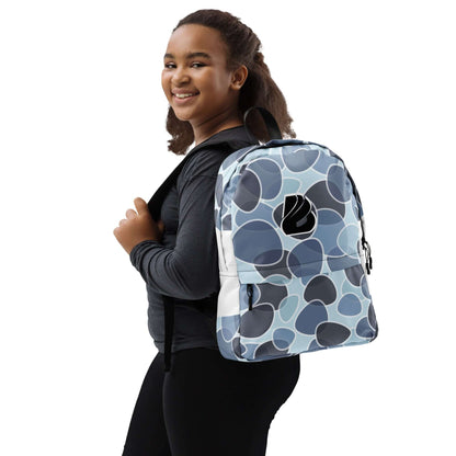 Smiling person carrying Rucksack N°5 with abstract pattern design, ideal for daily use and outdoor activities.