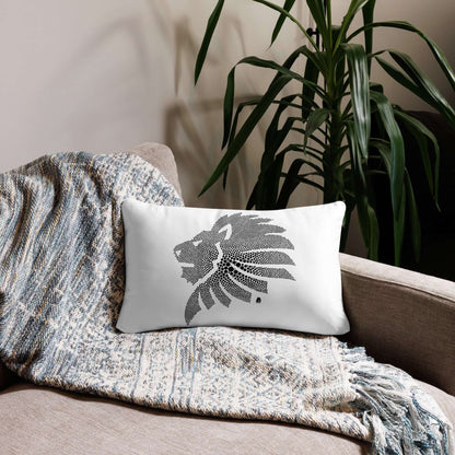 Cozy sofa with Basic-Kissen N°0 featuring a lion design, on a gray textured throw, set against a backdrop of greenery.