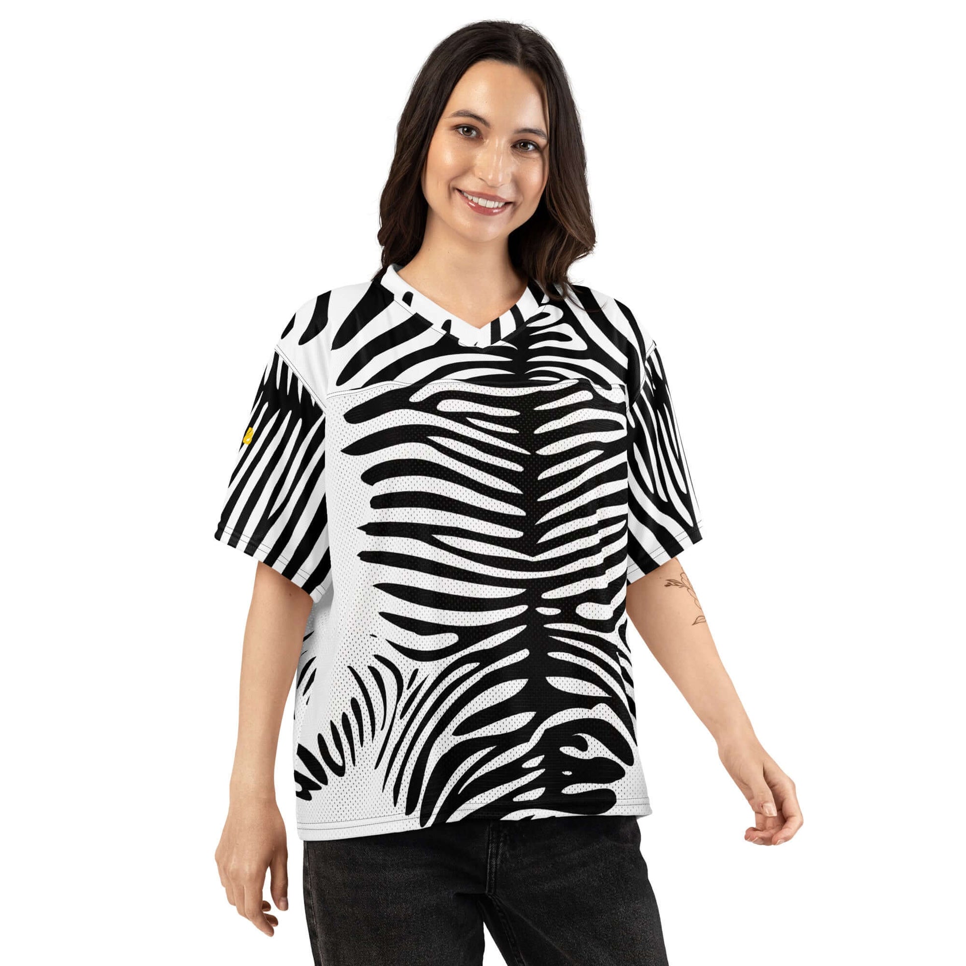 Woman wearing a Weit geschnittenes Football-Trikot with zebra pattern, made of silky stretch top and breathable mesh bottom.