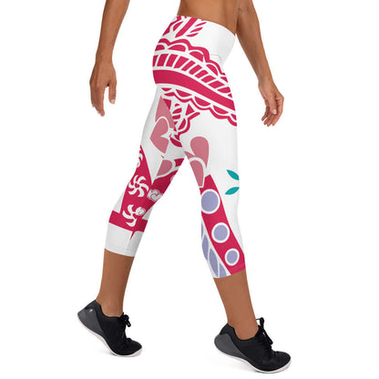Woman wearing Capri-Leggings N°4 with vibrant red and purple patterns, showcasing comfort and flexible fit.