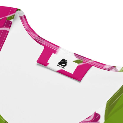 Close-up of colorful Sublimation-Cut-&-Sew-Kleid N°6 fabric and label, showcasing vibrant pink and green design on stretchy microfaser yarn.