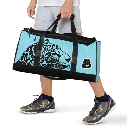 Person carrying the blue and black Weekender N°27 bag with leopard design, adjustable shoulder straps, and ample storage.