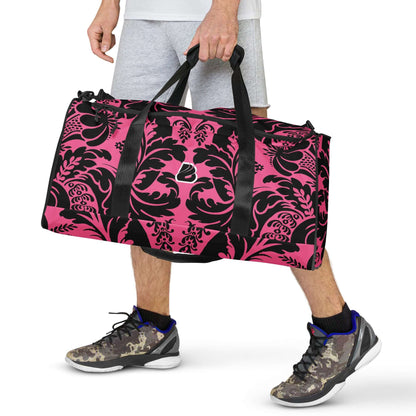 Person carrying stylish pink and black patterned Weekender N°29 travel bag with adjustable shoulder straps.
