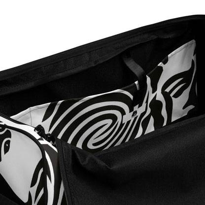 Interior view of Weekender N°28 showing spacious compartments with artistic black and white design and zipper closure for secure storage.