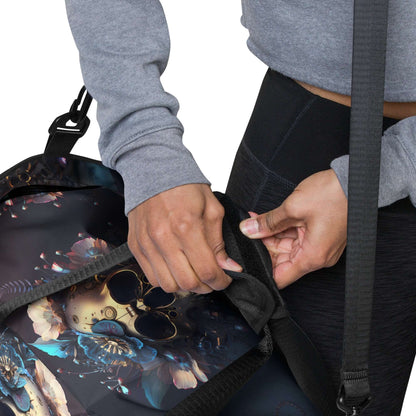 Person adjusting shoulder strap of Weekender N°31 with floral design, showing spacious interior and compartments for traveling or gym use.