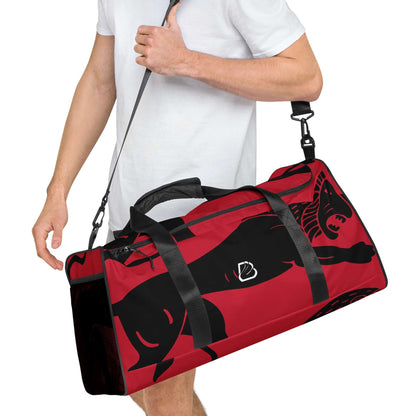 Person carrying red and black Weekender N°26 travel bag