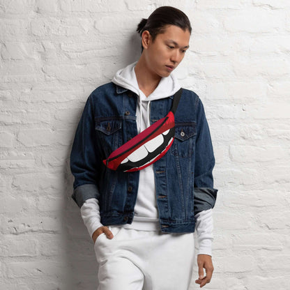 Person wearing Gürteltasche N°30, a stylish red waist bag ideal for travel and festivals, against a white brick wall.