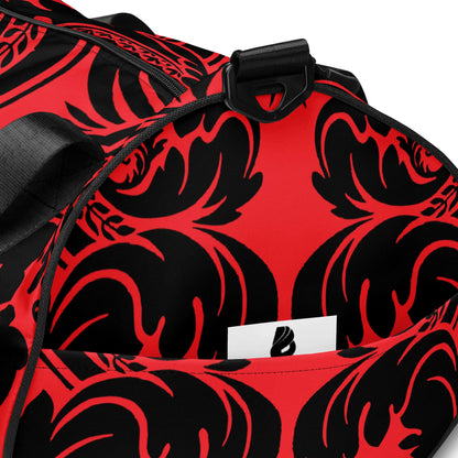Red and black Allover-Print-Sporttasche N°5 with intricate design, featuring sturdy handle and pocket, made from waterproof polyester.