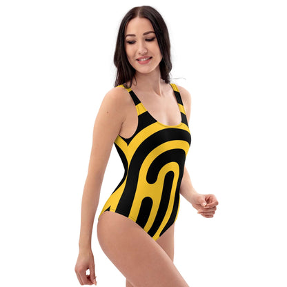 Model wearing Einteiliger Badeanzug N°20 with bold black and yellow design, perfect for beach or pool, flattering fit.