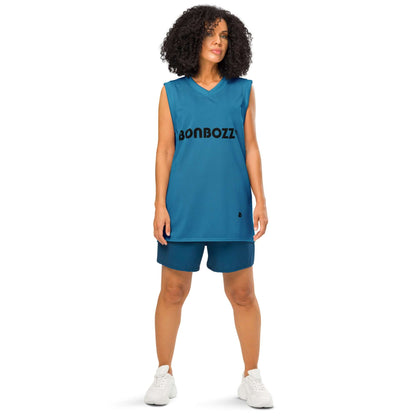 Woman wearing a blue premium basketball jersey with mesh fabric, showcasing unisex fit and durable design for sports and streetwear.
