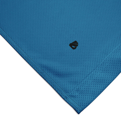 Close-up of blue mesh fabric from a premium basketball jersey, showcasing detailed texture and stitching.