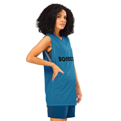 Woman wearing premium basketball jersey in blue with mesh fabric and ribbed collar, ideal for athletic and streetwear looks.