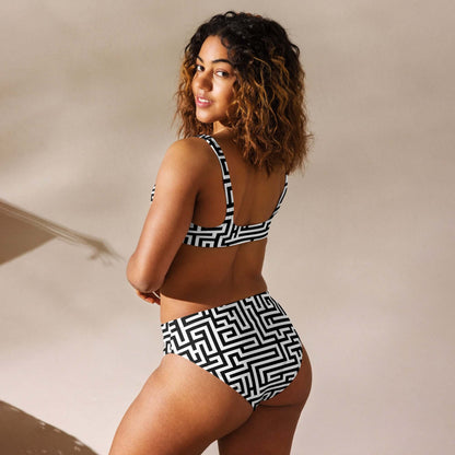 Woman wearing Recycelter Allover High Waist Bikini N°2 with geometric pattern, eco-friendly swimwear made from recycled materials.