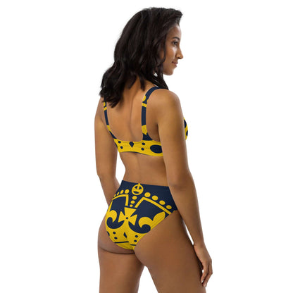 Model wearing Recycelter Allover High Waist Bikini N°1 in yellow and navy with intricate patterns, showcasing back and side view.