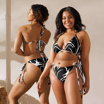 Model wearing Recycelter Schnürbikini mit Allover-Druck N°0 made from recycled polyester with UPF 50+, showcasing front and back design.