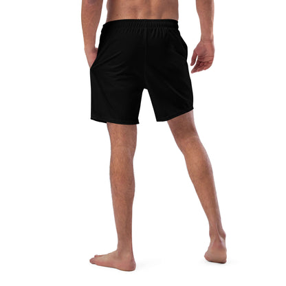 Hinteransicht eines Mannes in Herren-Badehosen N°11, schnell trocknend und atmungsaktiv, mit mehreren Taschen und seidigem Innenfutter.