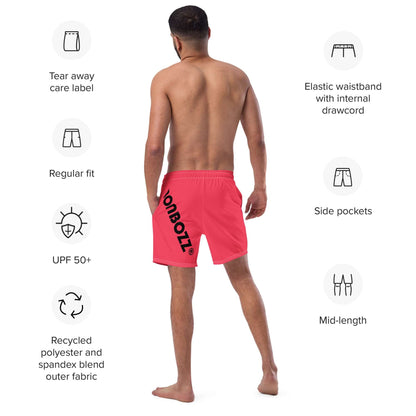 Man wearing Herren-Badehosen N°13 showcasing rear view, elastic waistband, side pockets, and tear-away label on a white background.