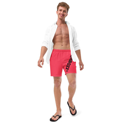 Man wearing Herren-Badehosen N°13 in red, showcasing quick-drying and breathable swim shorts with multiple pockets and silky lining.