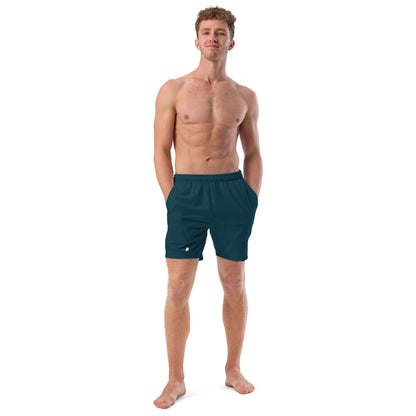 Man wearing Herren-Badehosen N°15, quick-drying swim shorts with pockets and anti-chafe lining.