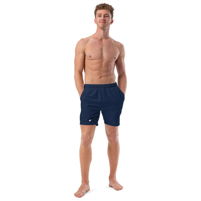 Man wearing Herren-Badehosen N°16, breathable and quick-dry swim shorts with pockets, ideal for summer. Made from recycled materials.