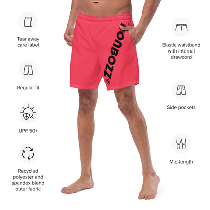 Man wearing Herren-Badehosen N°13, red swim shorts with elastic waistband and side pockets, made of recycled polyester blend.