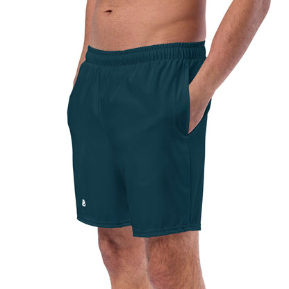 Man wearing Herren-Badehosen N°15 with quick-dry, breathable fabric, featuring pockets and silky anti-chafe lining.