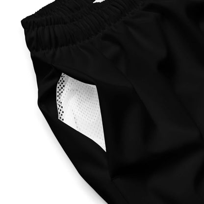 Close-up of Herren-Badehosen N°11 highlighting mesh pocket and black fabric.