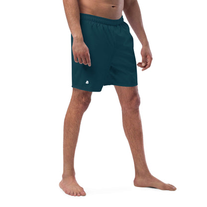Man wearing Herren-Badehosen N°15, dark green swim shorts with quick-dry fabric and pockets, ideal for summer.