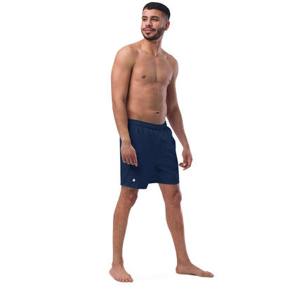 Man modeling Herren-Badehosen N°16 in navy blue, summer swimwear with quick-dry fabric and breathable design.