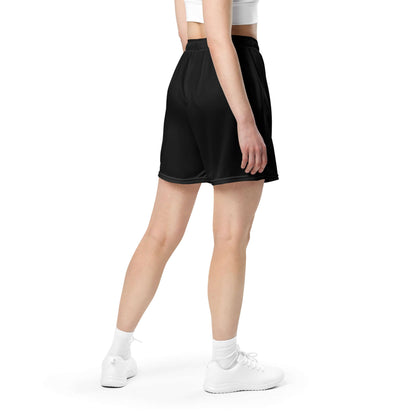 Back view of model wearing Unisex Mesh-Shorts N°0 in black, perfect for gym, shopping, or leisure, made from 100% recycled polyester.