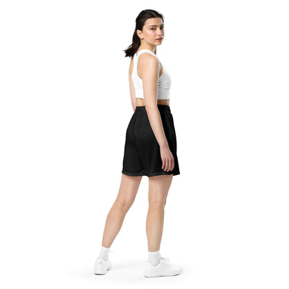 Model wearing Unisex Mesh-Shorts N°0, ideal for gym, shopping, or leisure, featuring recycled polyester and moisture-wicking fabric.