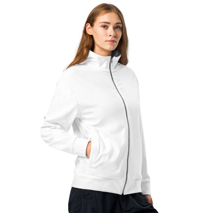 Model wearing Unisex-Trainingsjacke N°1, a stylish white zip-up jacket made from recycled materials with fleece lining.