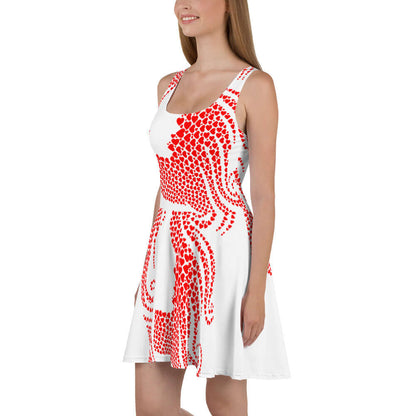 Woman wearing Skater-Kleid N°7 with red pattern on white fabric, sleeveless design, and flared skirt.