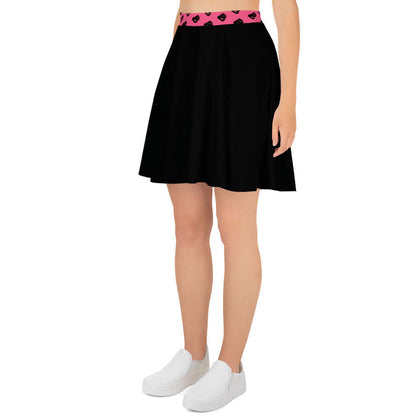 Woman wearing a knee-length Skater-Rock N°10 with a pink waistband, featuring a flattering silhouette and smooth fabric.