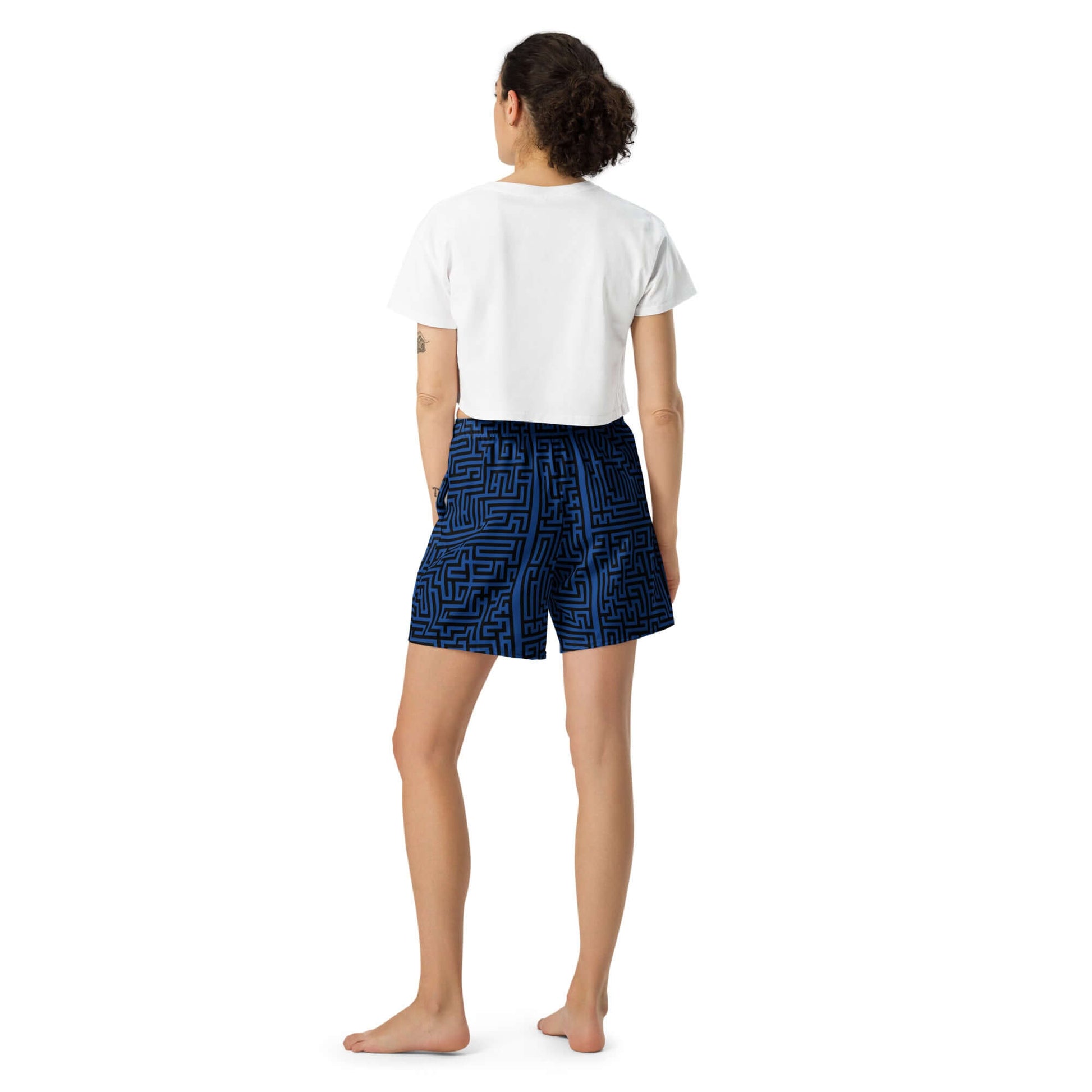 Rear view of person wearing Lange Unisex Sport-Shorts, blue pattern, suitable for various sports activities.