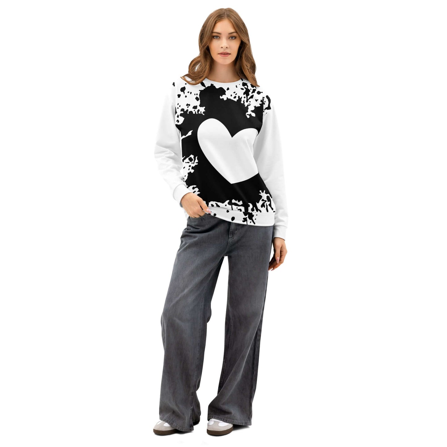 Model wearing unisex pullover with black and white heart design, relaxed fit, ideal for casual outfits and streetwear.