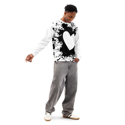 Fashionable black and white sweatshirt with heart design, worn by a person in casual jeans and sneakers, showcasing a trendy street style.
