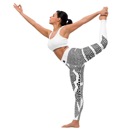 Woman performing yoga stretch in Yoga-Leggings N°45, featuring black and white pattern and high waistband for comfort and flexibility.