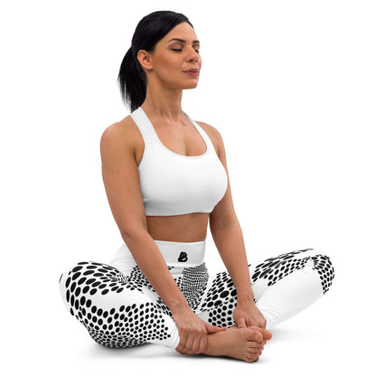Woman in meditative pose wearing Yoga-Leggings N°45 with black and white polka dot pattern