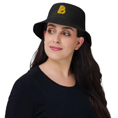 Person wearing the Old School-Fischerhut N°2, black bucket hat with a vintage design, perfect for outdoor activities like fishing and hiking.