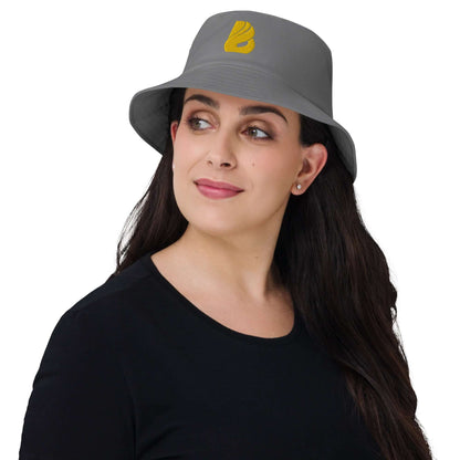 Woman wearing the Old School-Fischerhut N°2 in gray, showcasing its vintage style and functional design with yellow embroidery