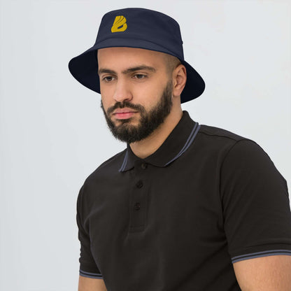 Man wearing Old School-Fischerhut N°2 in navy blue, showcasing vintage style and functionality.