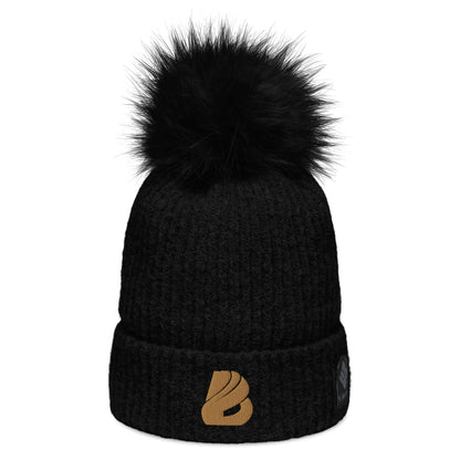 Columbia Bommelmütze in schwarz mit Kunstfaser-Bommel, doppellagigem Strick, ideal für winterliche Tage, weiches Polyester-Mikrofleece-Futter.