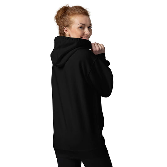 Model wearing a black Unisex-Kapuzenpullover with a cozy hood and front pouch pocket, ideal for cool evenings and streetwear style.