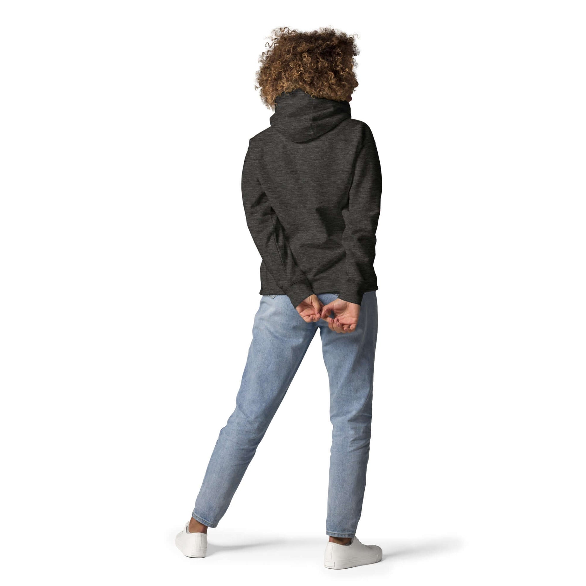 Person wearing Unisex-Kapuzenpullover with practical pocket, showcasing casual streetwear style. Back view.