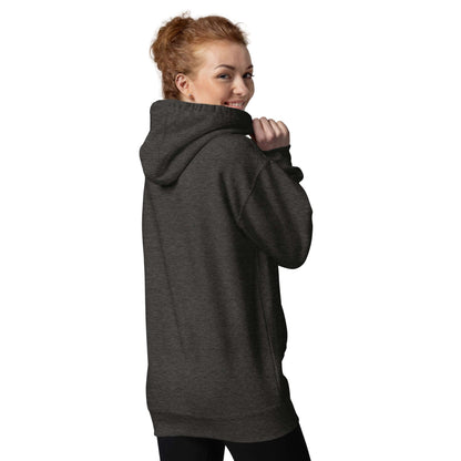 Woman wearing a charcoal Unisex-Kapuzenpullover with front pocket and hood.