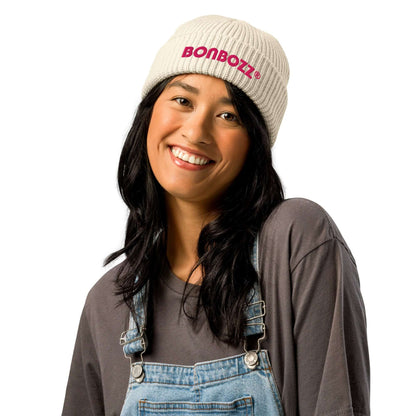 Woman wearing Fischermütze N°0 in ribbed knit hat, trendy beanie in off-white, keeping head warm, perfect for cold weather and various outfits.