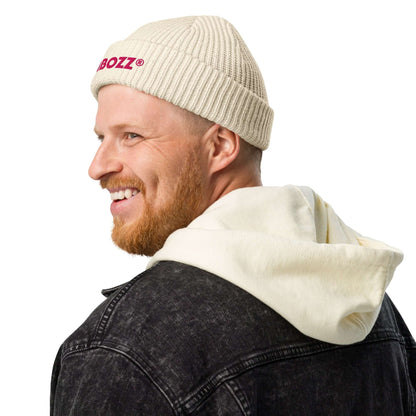 Man wearing Fischermütze N°0 beanie with ribbed knit, perfect for cold weather and versatile style. 100% acrylic fabric, fits various outfits.