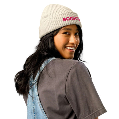 Woman wearing Fischermütze N°0 beanie in cream, styled with casual outfit