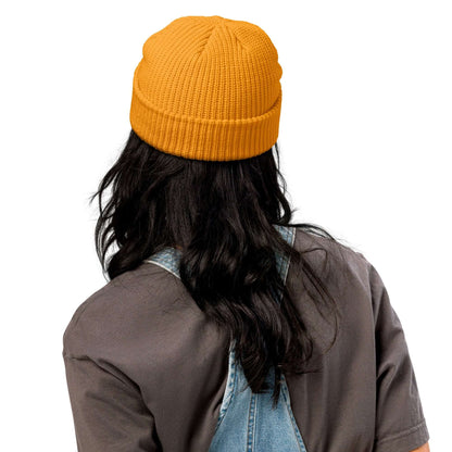 Person wearing yellow Fischermütze N°0 beanie with ribbed texture, ideal for cold weather and versatile style.